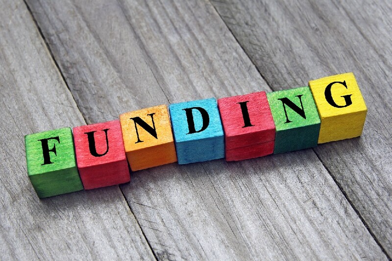 The word "funding" is spelled out in colorful block letters.