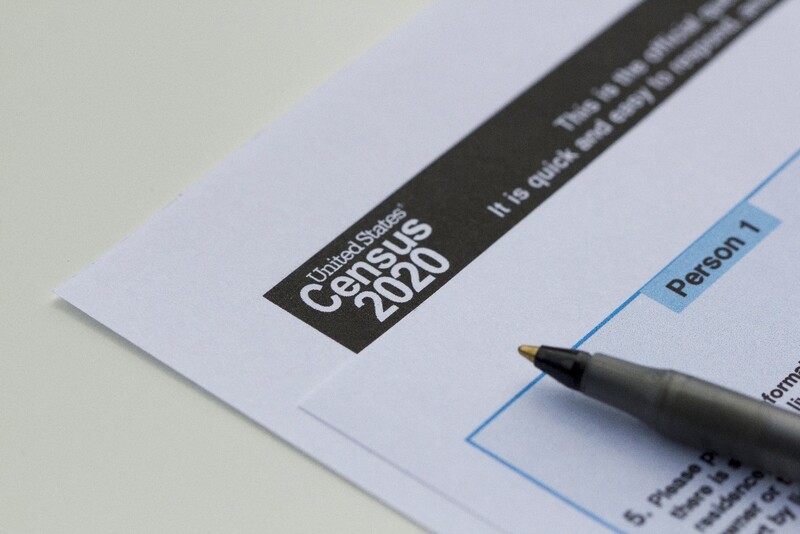 A Census 2020 form lying on a flat surface with a pen