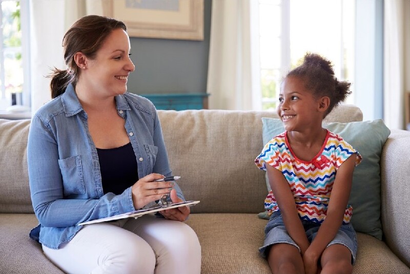 New grant awards aim to improve behavioral health services for children and their families in the Coachella Valley. Stock Photo A little girl sits on a sofa and chats with a woman who's a counselor. Stock Photo