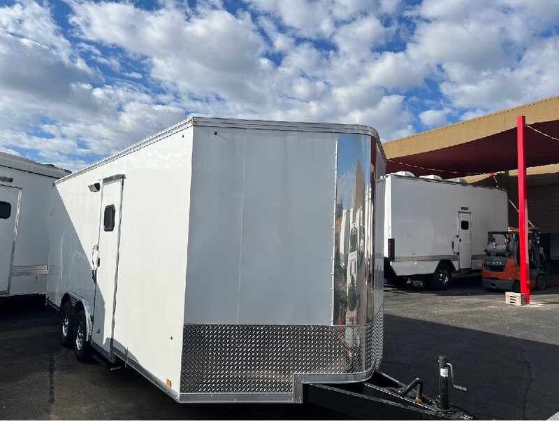 Exterior view of white, 25-foot, mobile medical trailer with similar trailers in the background. Submitted Photo