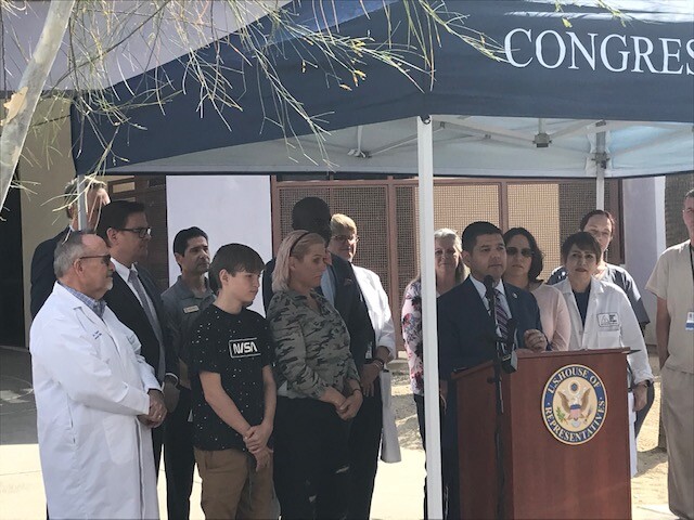 Congressman Dr. Raul Ruiz addresses the media at an outdoor podium at D.A.P. Congressman Dr. Raul Ruiz addresses the media at an outdoor podium at D.A.P.